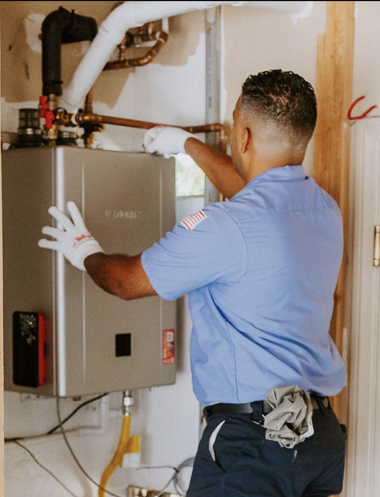 Man repairing a water heater